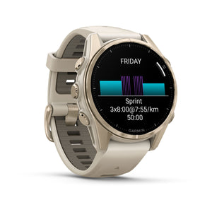 fēnix® 8 – 43 mm, AMOLED, Sapphire, Soft Gold mit Fog Grey/Dark Sandstone Silikonarmband – Garmin
